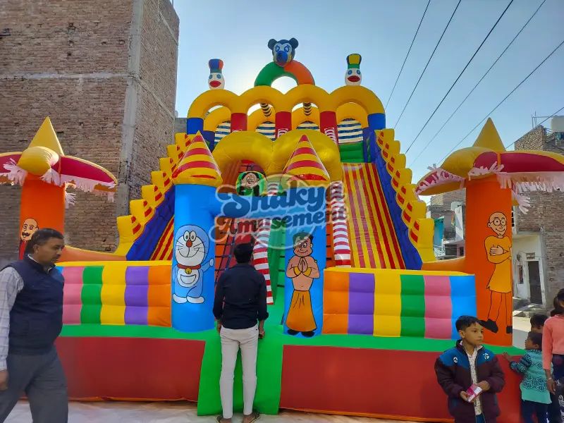 18x26 Ft 4-Lane Cartoon Theme Bouncy Slide with Side Bouncer – Inflatable Bounce Castles by Shakya Amusement, New Delhi